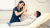 A Pediatric Orthopedist Giving A Patient A High Five