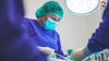 A Trauma Surgeon Operating On A Patient