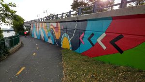A colorful mural alongside the Charles River Bike Path