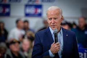 Joe Biden speaking into a microphone