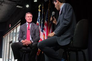 Sen. Dick Durbin being interviewed by a man holding a microphone