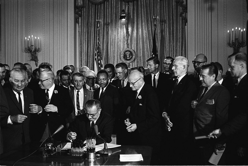 President Lyndon Johnson signing of the Civil Rights Act in 1964