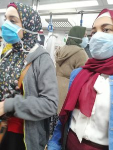 Women wearing masks inside a metro train in Egypt