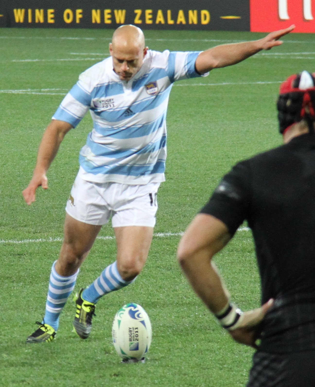 Felipe Contepomi kicking a football on the field