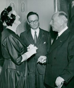 A black and white photograph of Lady Churchill in conversation with Hans Krebs and Frits Zernike