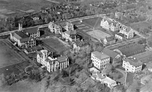 A black and white aerial photograph of Queen's University Medical School in Ontario