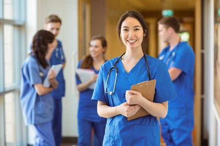 Medical student smiling at the camera at the university-1 - test