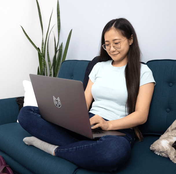 Student on Couch with Laptop_600px