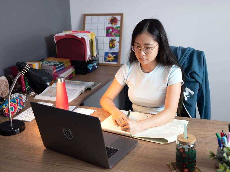 A student studying at her desk